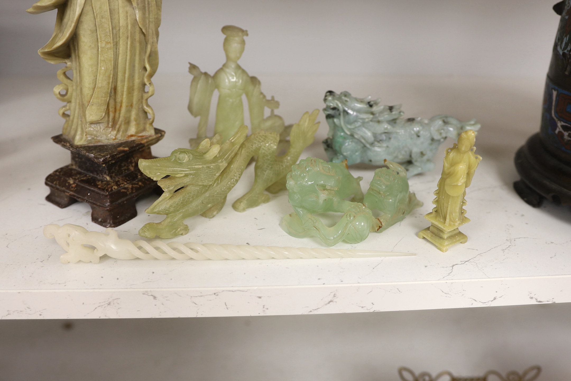 A Chinese soapstone figure, a jadeite figure of a qilin and various bowenite figures etc., tallest 30cm